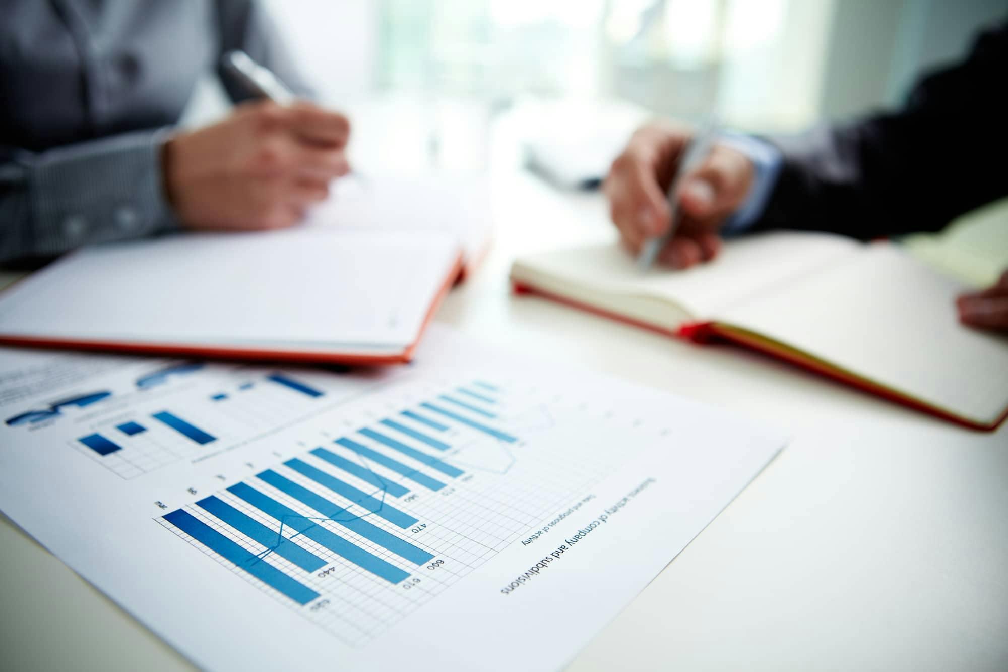 work table to notebooks and data graphs