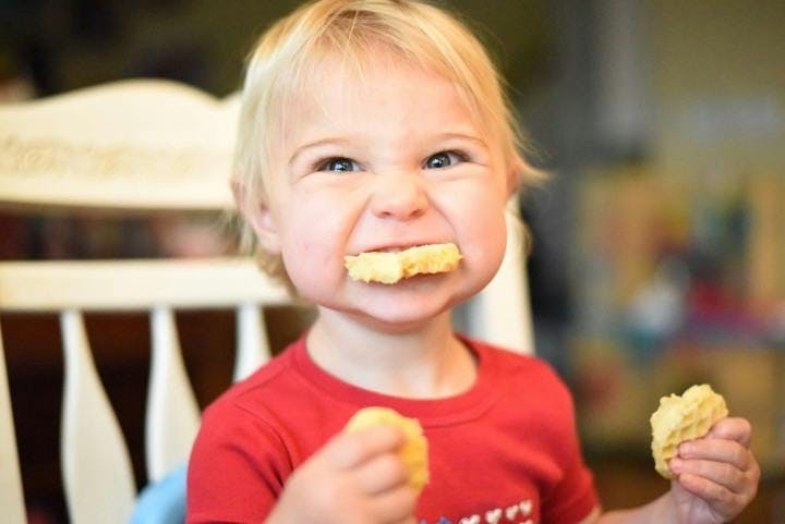 kid eating waffles